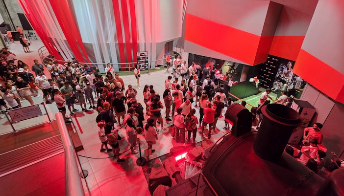 Visitors exploring exhibits at Museo River in Mâs Monumental stadium, Buenos Aires.