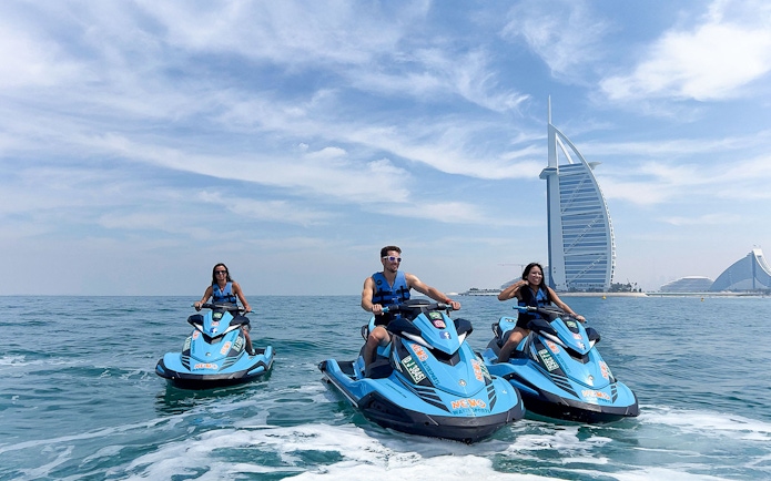 Group jetskiing near Burj Al Arab, Dubai.