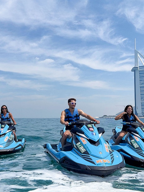 Group jetskiing near Burj Al Arab, Dubai.