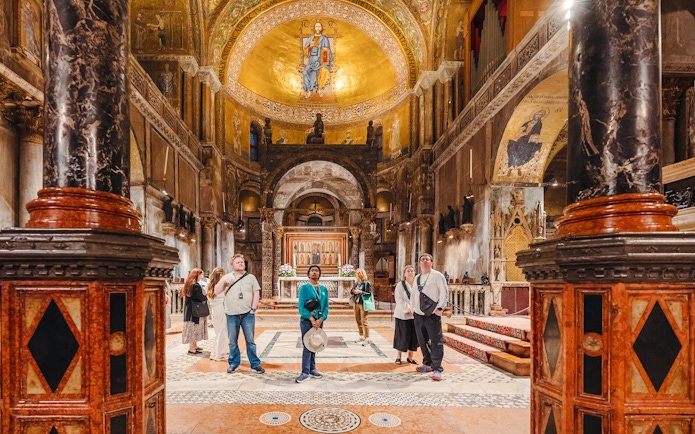 Visitors exploring St. Mark's Basilica interior during exclusive after-hours tour in Venice.