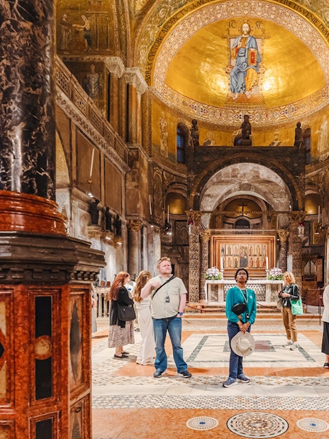 Visitors exploring St. Mark's Basilica interior during exclusive after-hours tour in Venice.