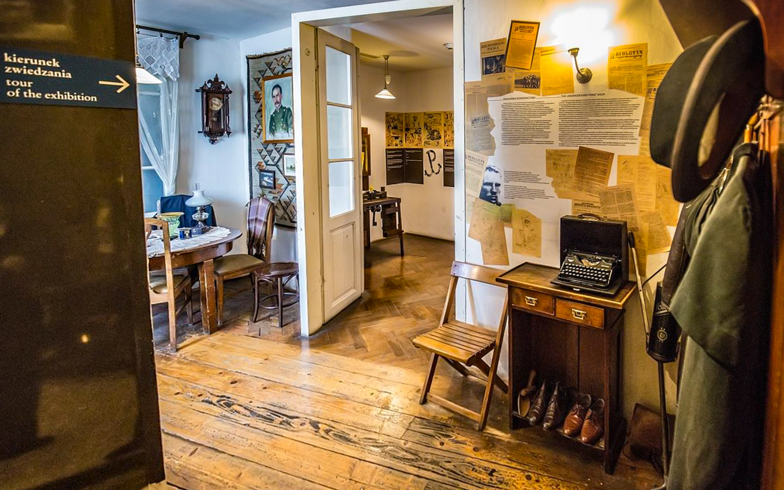 Exhibit room inside Oskar Schindler's Factory with typewriter and historical documents.