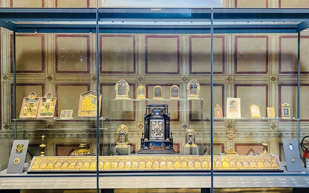 Artefacts displayed in a glass case at Bargello Museum, Florence.