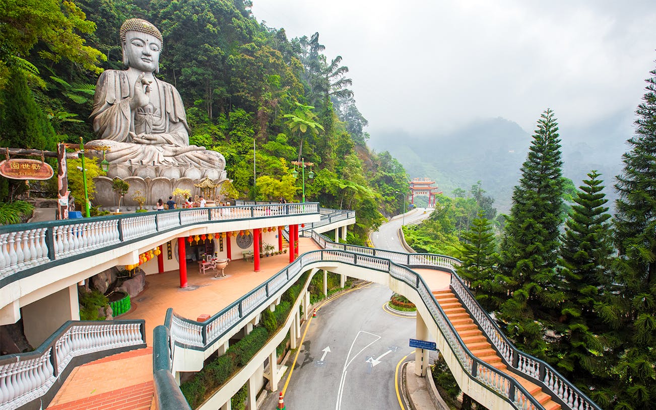 Buddha statue and temple walkway in Genting Highlands, Malaysia.