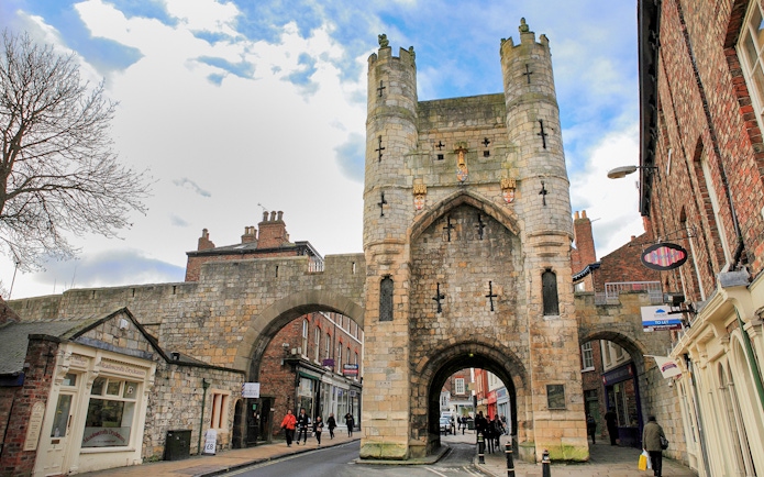 York city gate on the Hop-On-Hop-Off Tour route, showcasing medieval architecture.