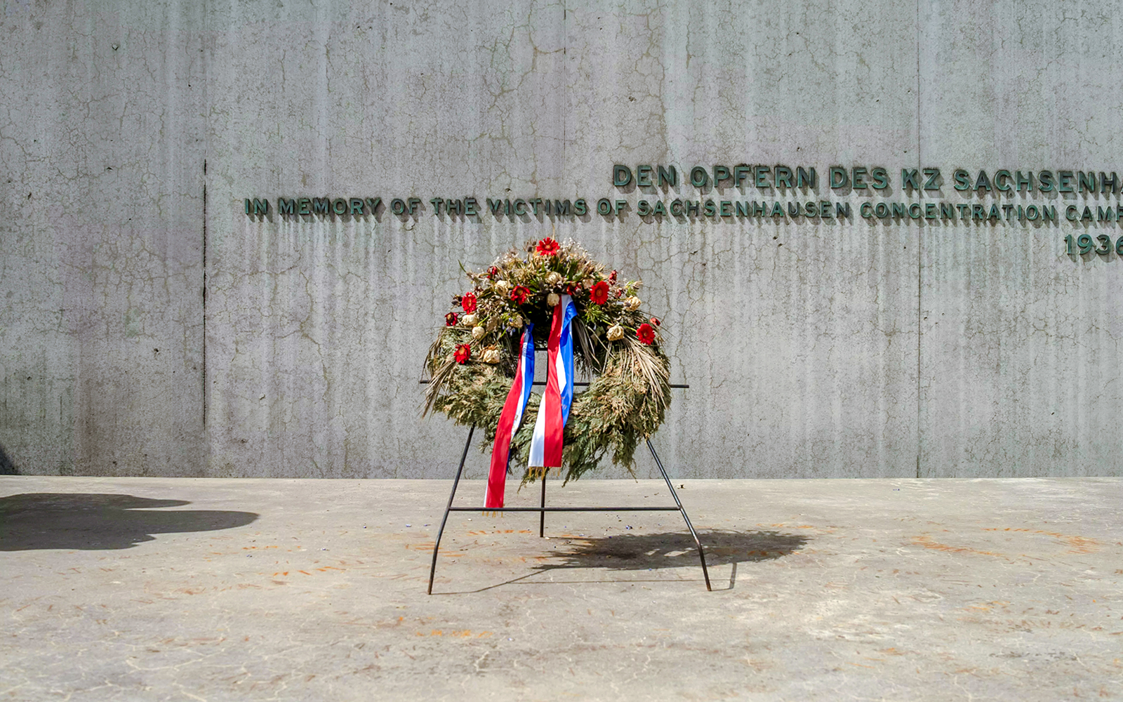 Wreath at Sachsenhausen Concentration Camp Memorial wall, Oranienburg, Germany.