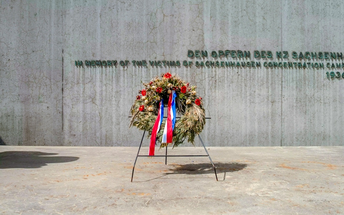 Wreath at Sachsenhausen Concentration Camp Memorial wall, Oranienburg, Germany.