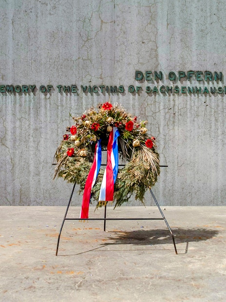 Wreath at Sachsenhausen Concentration Camp Memorial wall, Oranienburg, Germany.
