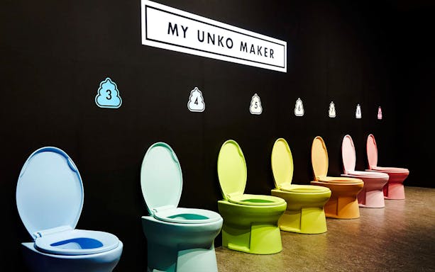 Pastel-colored toilets at "MY UNKO MAKER" exhibit, Unko Museum, Japan.