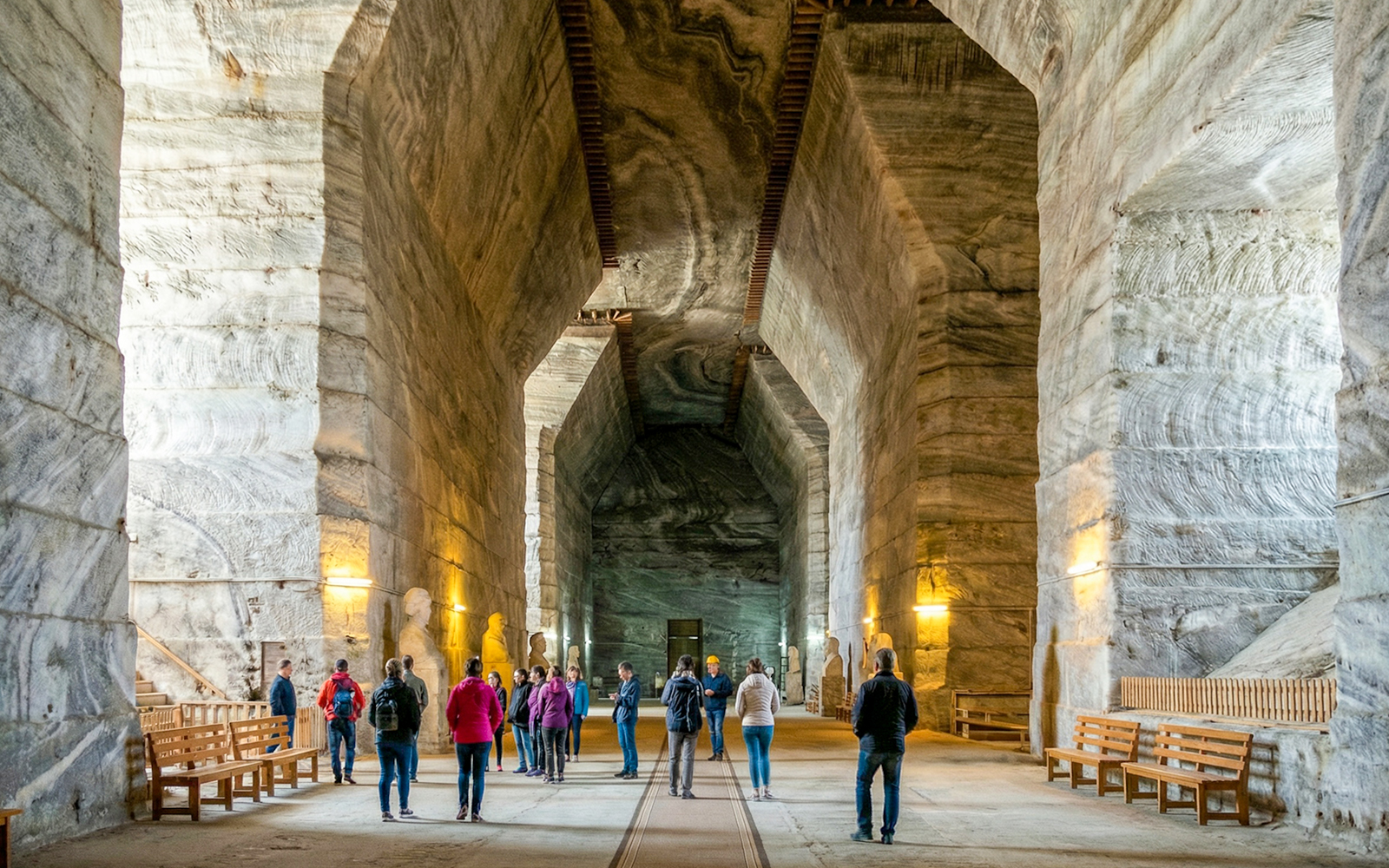 Guests exploring the vast chambers of Slanic Salt Mine in Romania.