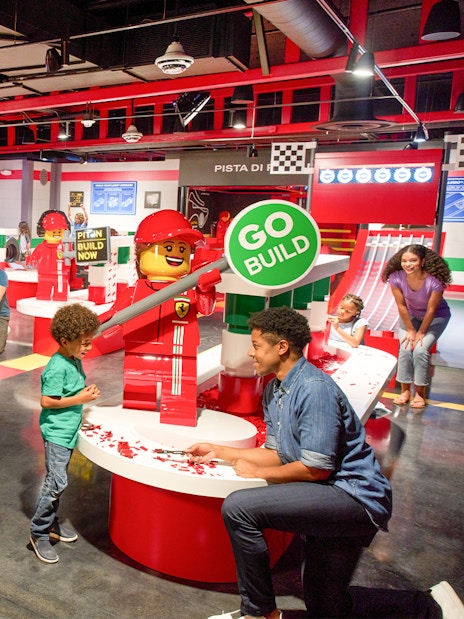 Children building LEGO cars at Ferrari Build and Race, LEGOLAND Florida.