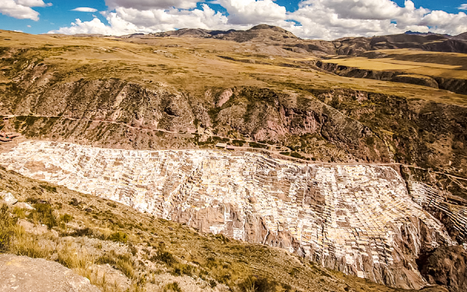 Maras Salt Mines in Sacred Valley, Peru, showcasing terraced salt evaporation ponds.