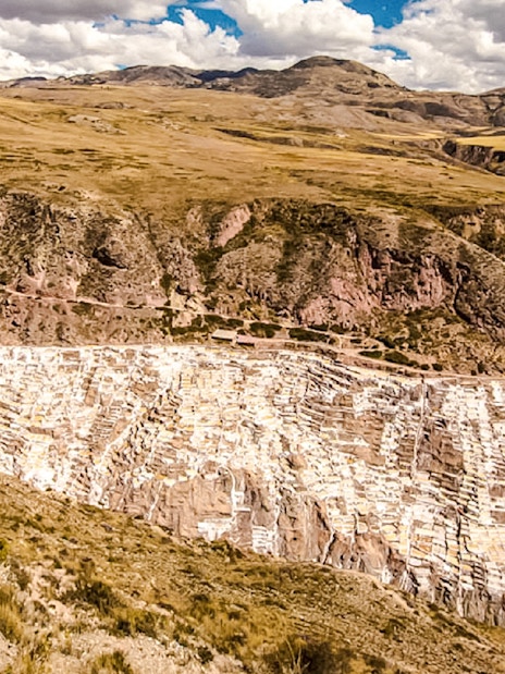 Maras Salt Mines in Sacred Valley, Peru, showcasing terraced salt evaporation ponds.