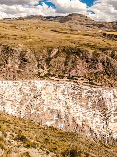 Maras Salt Mines in Sacred Valley, Peru, showcasing terraced salt evaporation ponds.