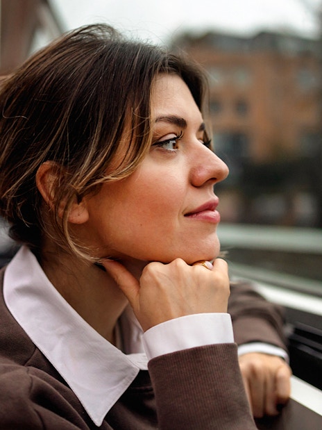 Woman enjoying view on Amsterdam canal cruise.