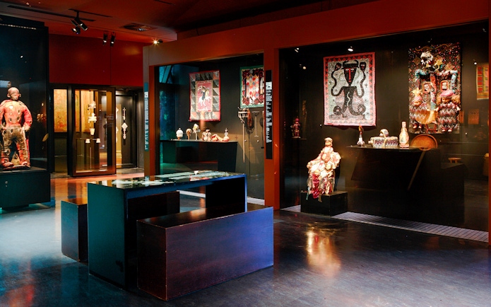 Exhibit of cultural artifacts and textiles at Musée du Quai Branly, Paris.