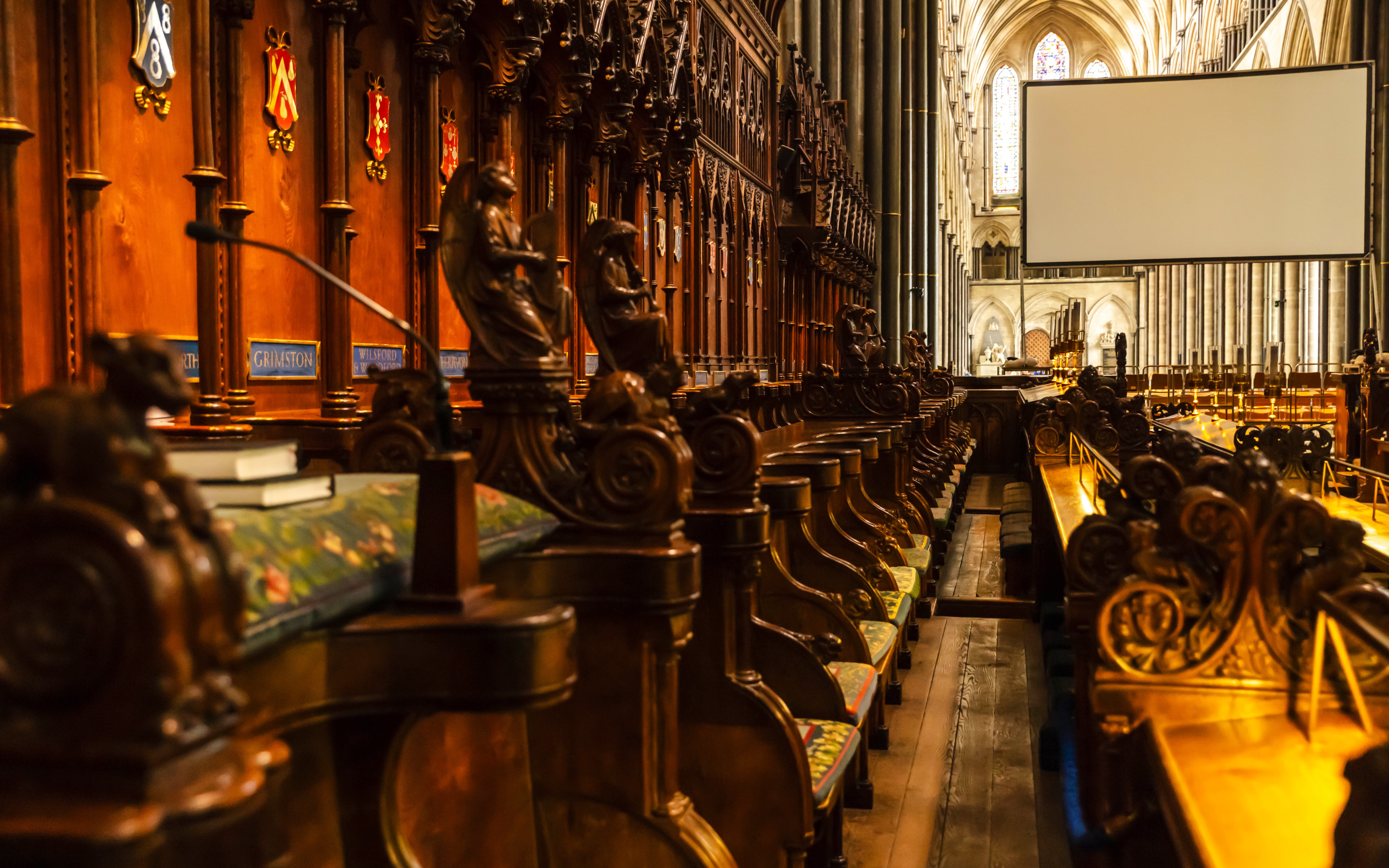 Choir stalls and ornate wood carvings inside Salisbury Cathedral.