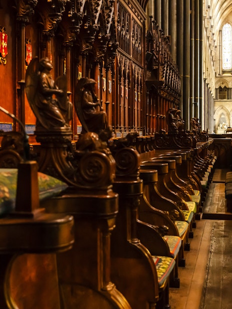 Choir stalls and ornate wood carvings inside Salisbury Cathedral.