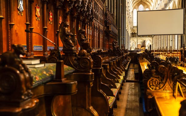Choir stalls and ornate wood carvings inside Salisbury Cathedral.