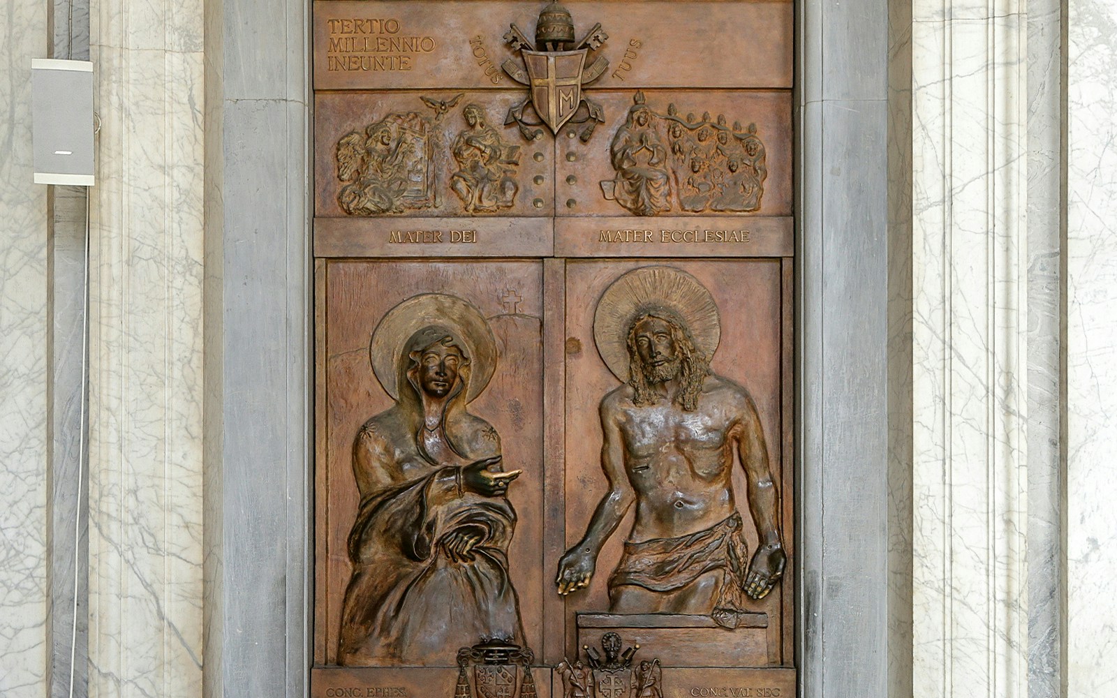 Close-up of Holy Gates relief in Basilica of Santa Maria Maggiore, Rome, depicting religious figures.