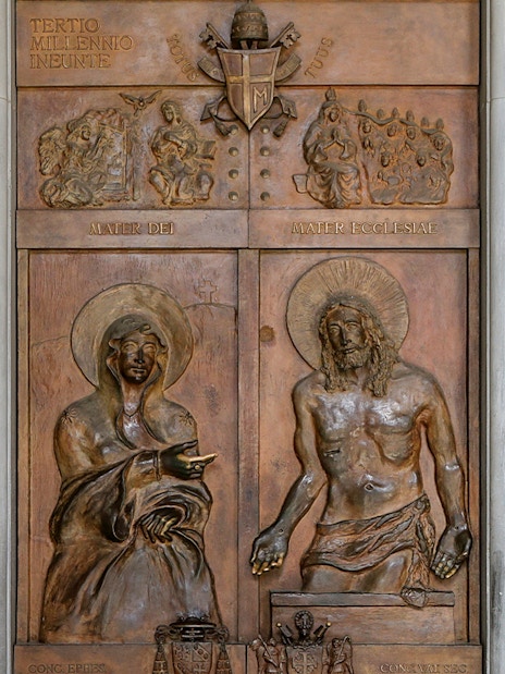 Close-up of Holy Gates relief in Basilica of Santa Maria Maggiore, Rome, depicting religious figures.