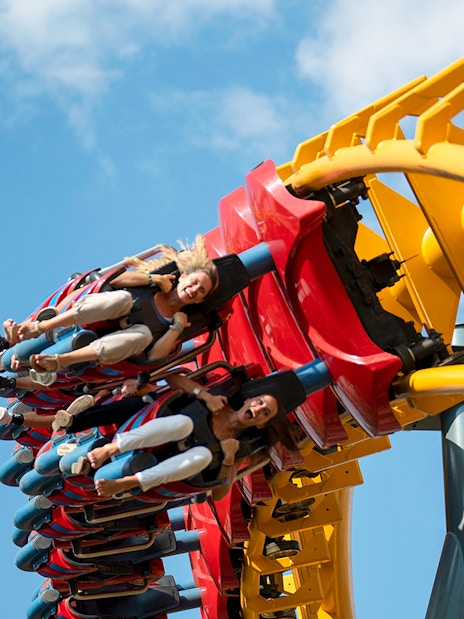 Riders on Isla Mágica roller coaster in Seville, Spain, during a loop.