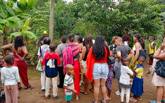 Tourists gather for a Giriama cultural dance show in a local village, Diani Beach.