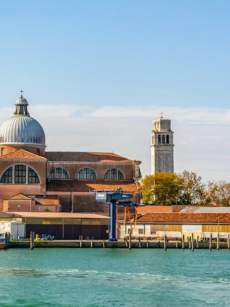 Basilica of San Pietro di Castello with bell tower, Venice waterfront.