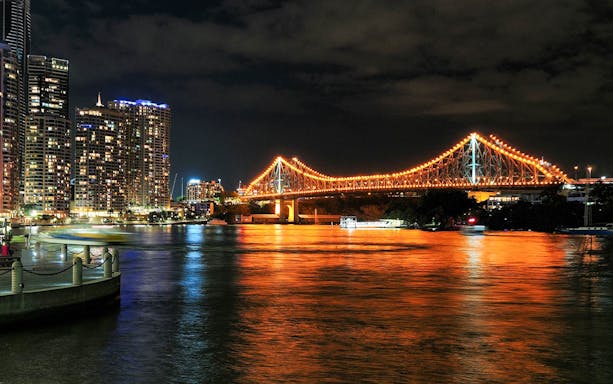 Story Bridge illuminated at night over Brisbane River, Queensland.