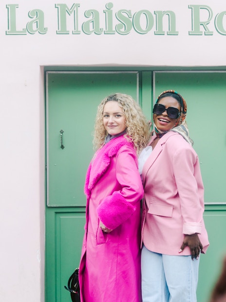 Ladies posing at La Maison Rose during Montmartre Walking Tour in Paris.