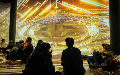 Guests viewing immersive digital art installation at ARTECHOUSE DC.