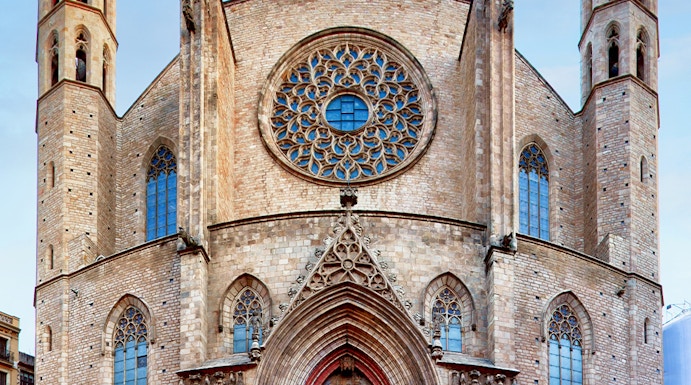 Santa Maria del Mar facade with rose window and twin towers in Barcelona.