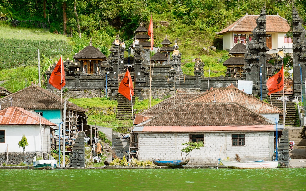 Ancient village Trunyan and Hindu Temple viewed from Lake Batur, Bali, Indonesia.