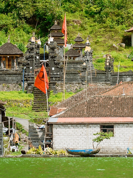 Ancient village Trunyan and Hindu Temple viewed from Lake Batur, Bali, Indonesia.