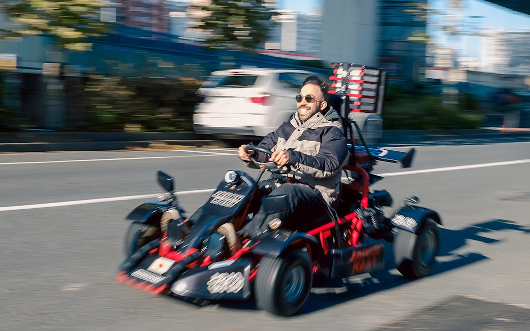 Man driving a go-kart on Asakusa street during 60-minute tour.