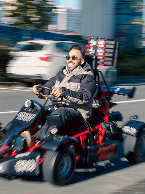 Man driving a go-kart on Asakusa street during 60-minute tour.