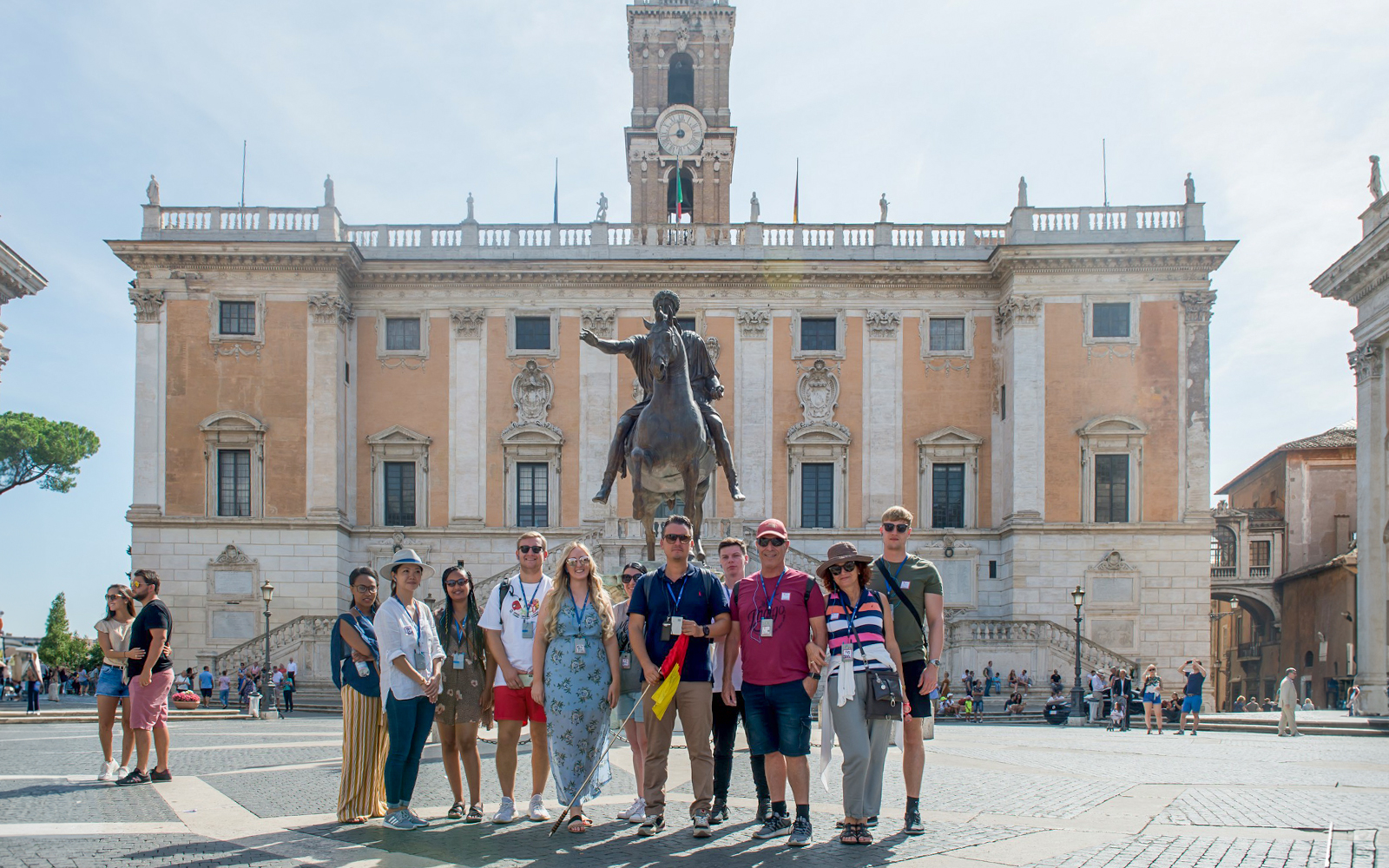 Group in front of Capitoline Museums with equestrian statue, Rome tour.