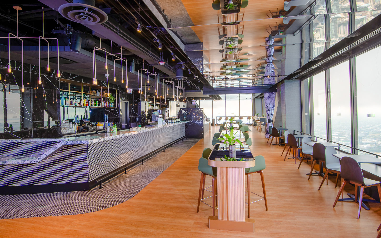 A wide angle of the seating arrangement and tables bar at 360 Chicago