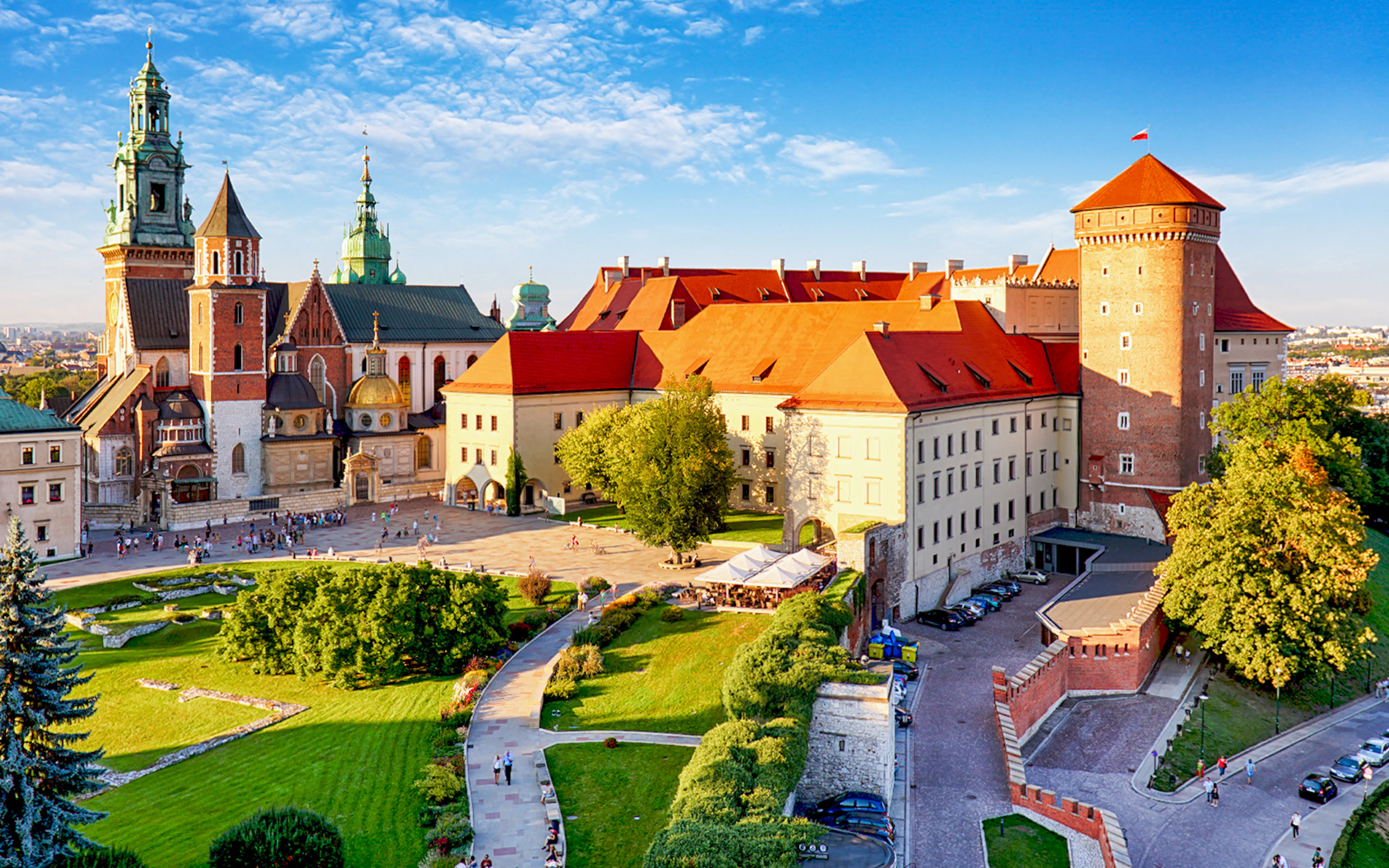 Aerial view of Wawel Castle in Krakow, showcasing its historic architecture and surrounding gardens.