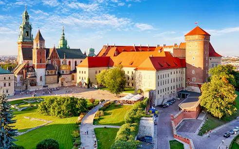Aerial view of Wawel Castle in Krakow, showcasing its historic architecture and surrounding gardens.