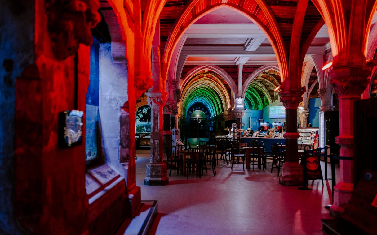 SEA Life Brighton interior with colorful arched ceilings and seating area.