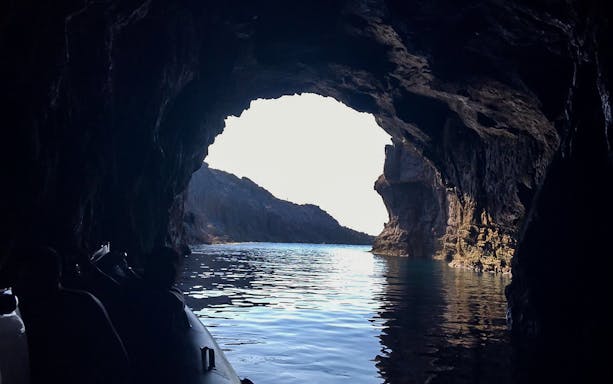 Sant'Antioco Island sightseeing cruise with skipper, showcasing coastal views and turquoise waters.