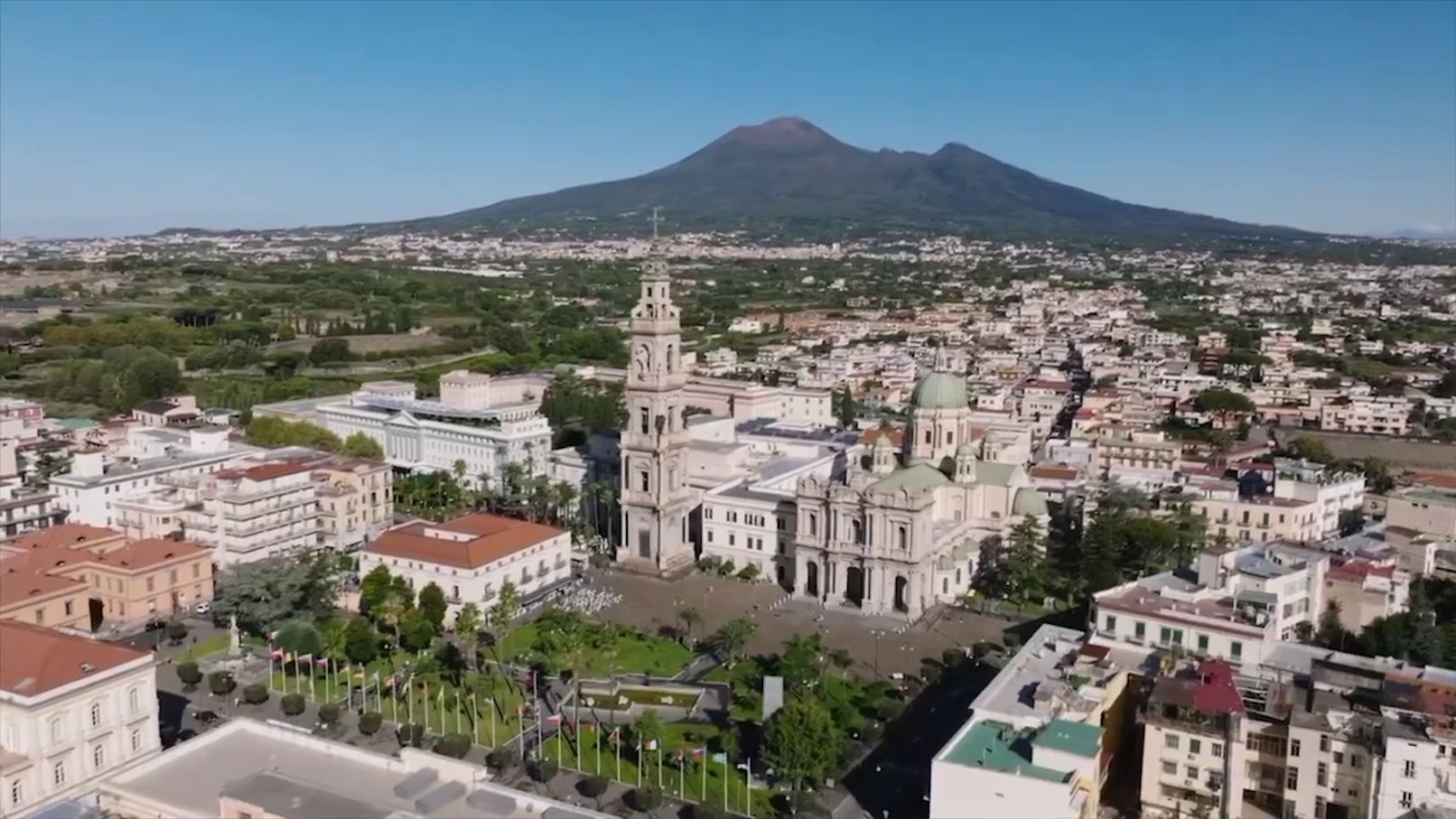 Gondolas on Venice's Grand Canal with historic buildings in the background.