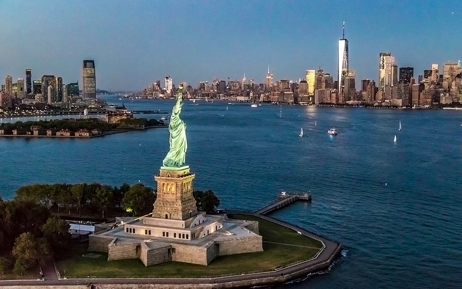 Statue of Liberty with Manhattan skyline during private NYC tour from Westchester.