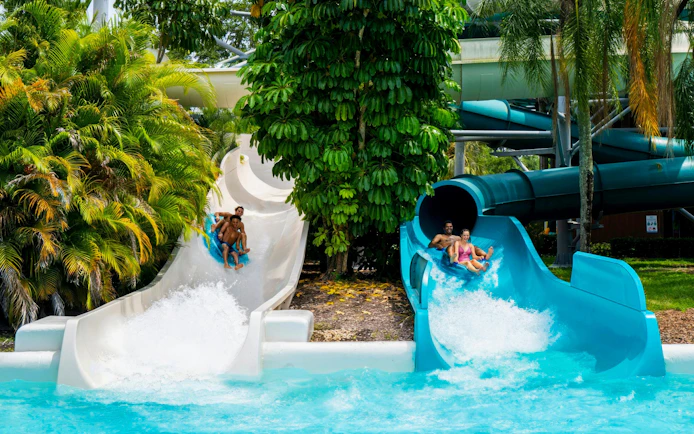 Water slides at Adventure Island, Tampa with people enjoying the ride.