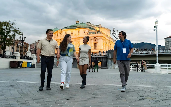 People walking in front of Teatro Arriaga in Bilbao, Spain.