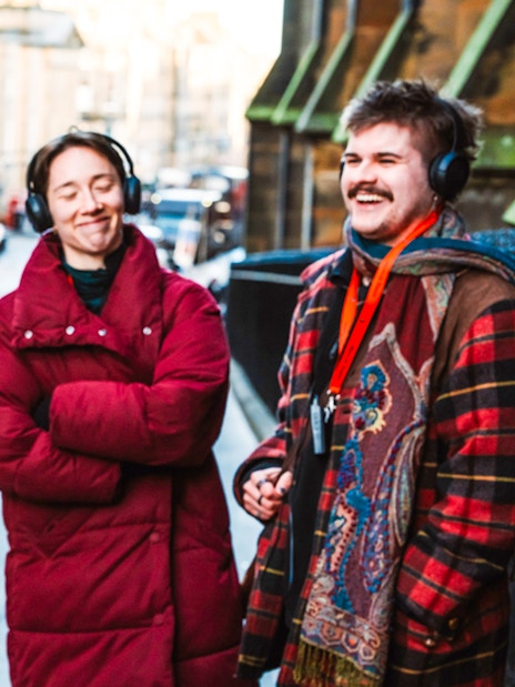 Tour group on the Royal Mile with guide from Mercat Tours, Edinburgh.