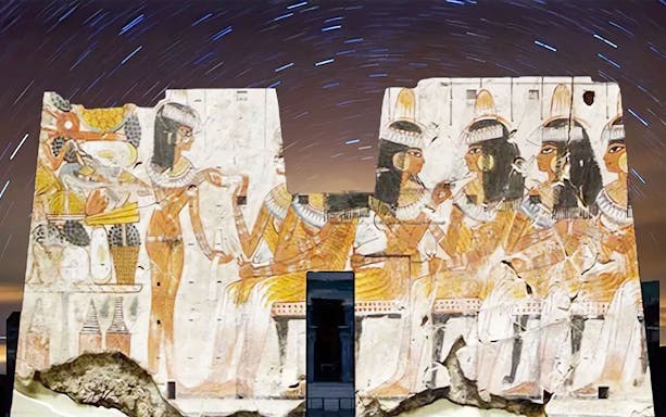 Edfu Temple illuminated with ancient Egyptian carvings during Sound and Light Show.