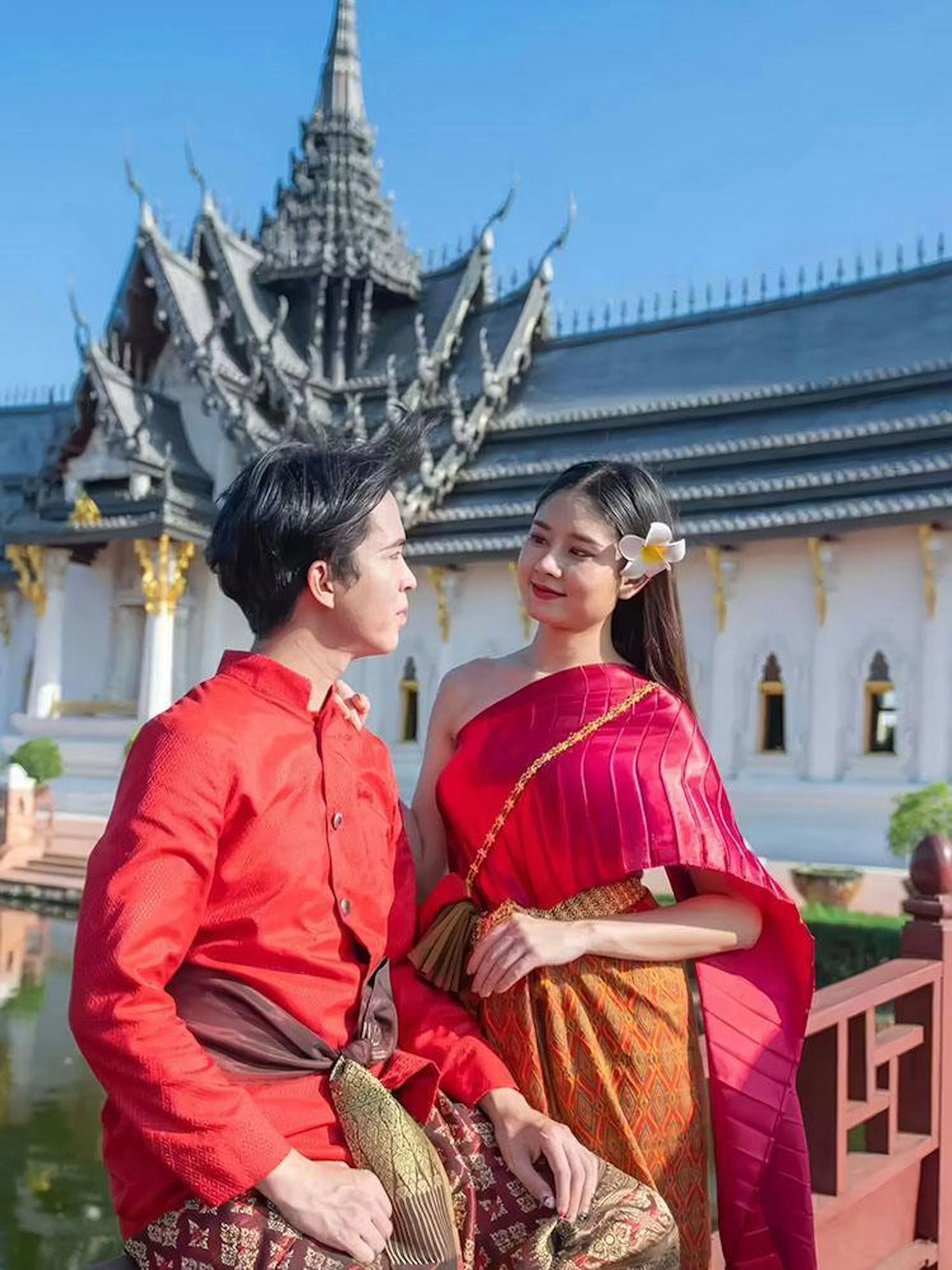 Couple in traditional attire at Ancient Siam open-air museum, Samut Prakan, Thailand.