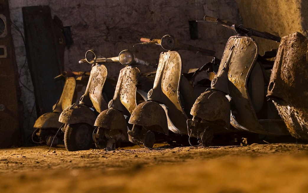 Vintage scooters in the Bourbon Tunnel, Naples guided tour.